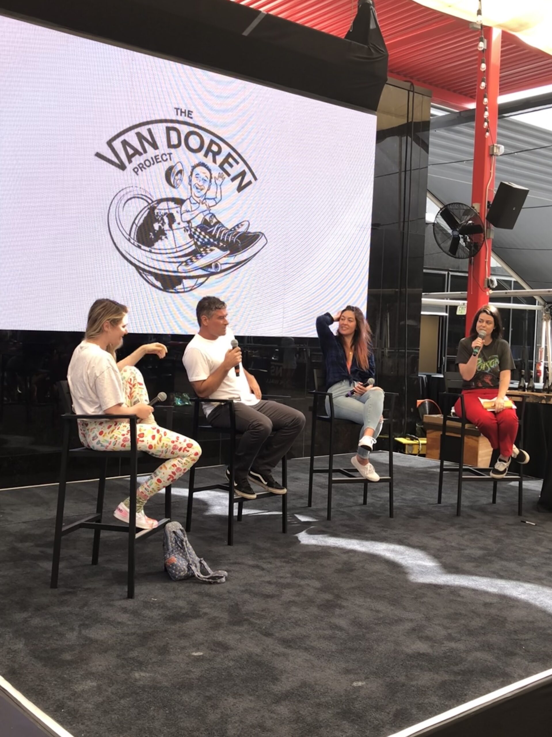 Four people on stage for The Van Doren Project panel discussion